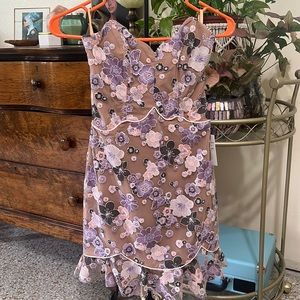 Strapless nude dress with purple and pink floral accents. New with tags